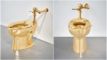 et toilet i guld set fra to vinkler