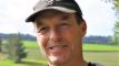 en smilende landmand