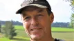en smilende landmand
