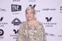 Signe Lindkvist i lys kjole til en gallapremiere