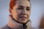 Mette Frederiksens ansigt omkranset af stor dynejakkekrave