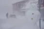 snestorm og en snemand