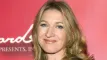 Smilende Steffi Graf med løst hår og sort bluse