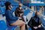 Personer på fodboldtribune