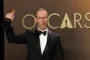en mand med en oscar