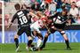 AaB's Siyabonga Nomvethe bliver holdt i kort snor af SønderjyskE. 
 Foto: Mick Anderson/POLFOTO / POLFOTO