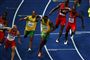 Michael Frater giver stafetten til Usain Bolt i VM-løbet
 Foto: AP / POLFOTO